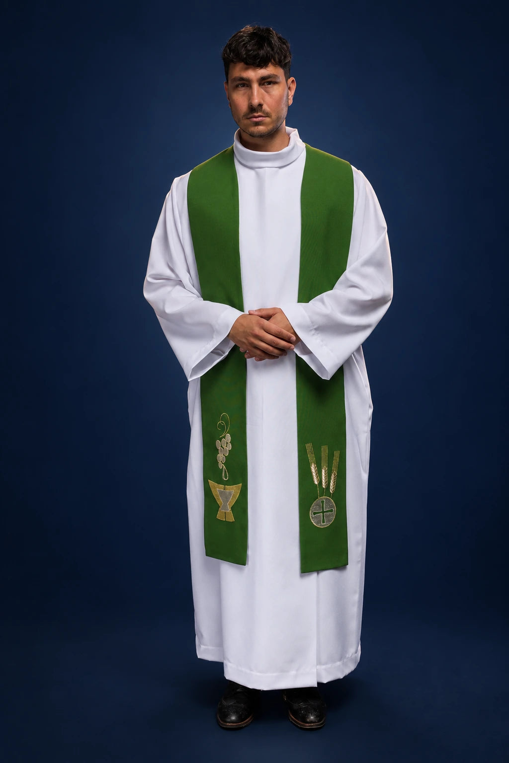 Front view of green priest stole over white alb, embroidered with chalice, wheat, and grapes motifs