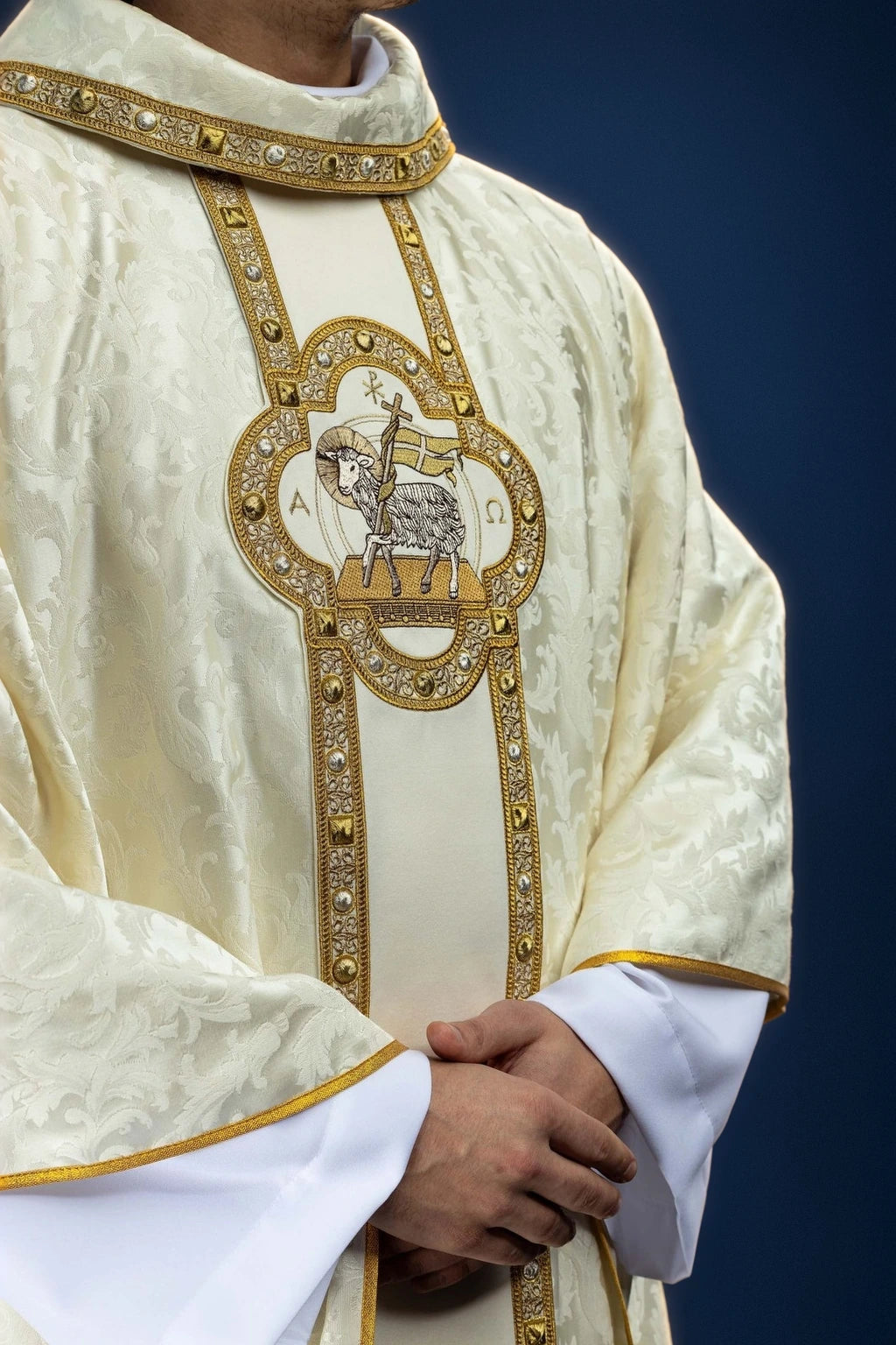 Front view of ivory chasuble with gold orphrey and Paschal Lamb embroidery on the chest