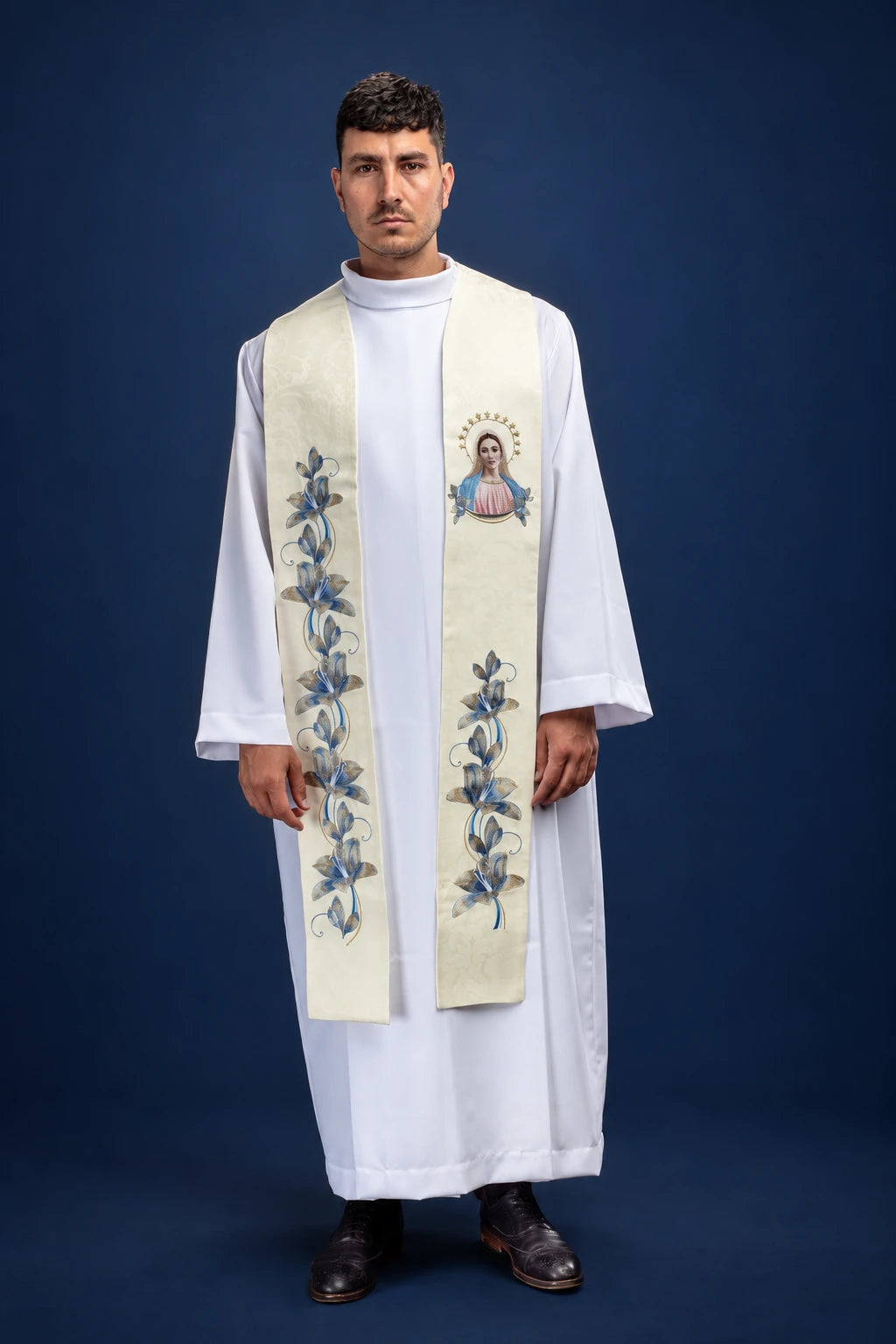 Front view of an ivory stole with blue floral embroidery and Our Lady of Medjugorje image on one side