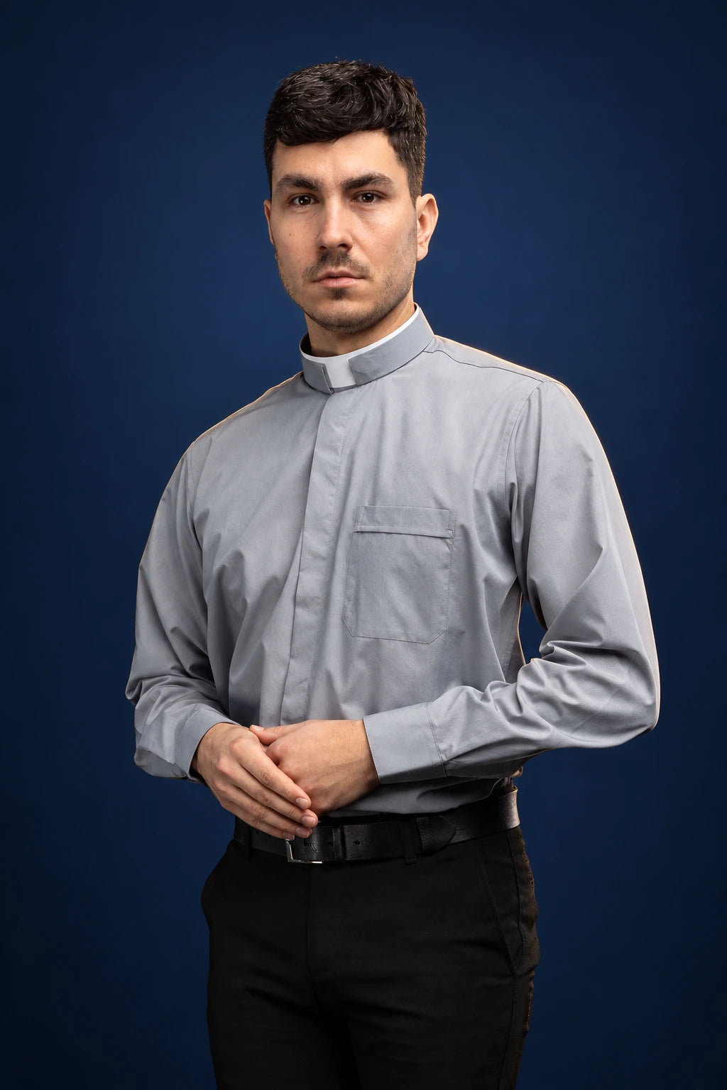 Front view of a light gray long-sleeve clergy shirt with Roman collar and chest pocket