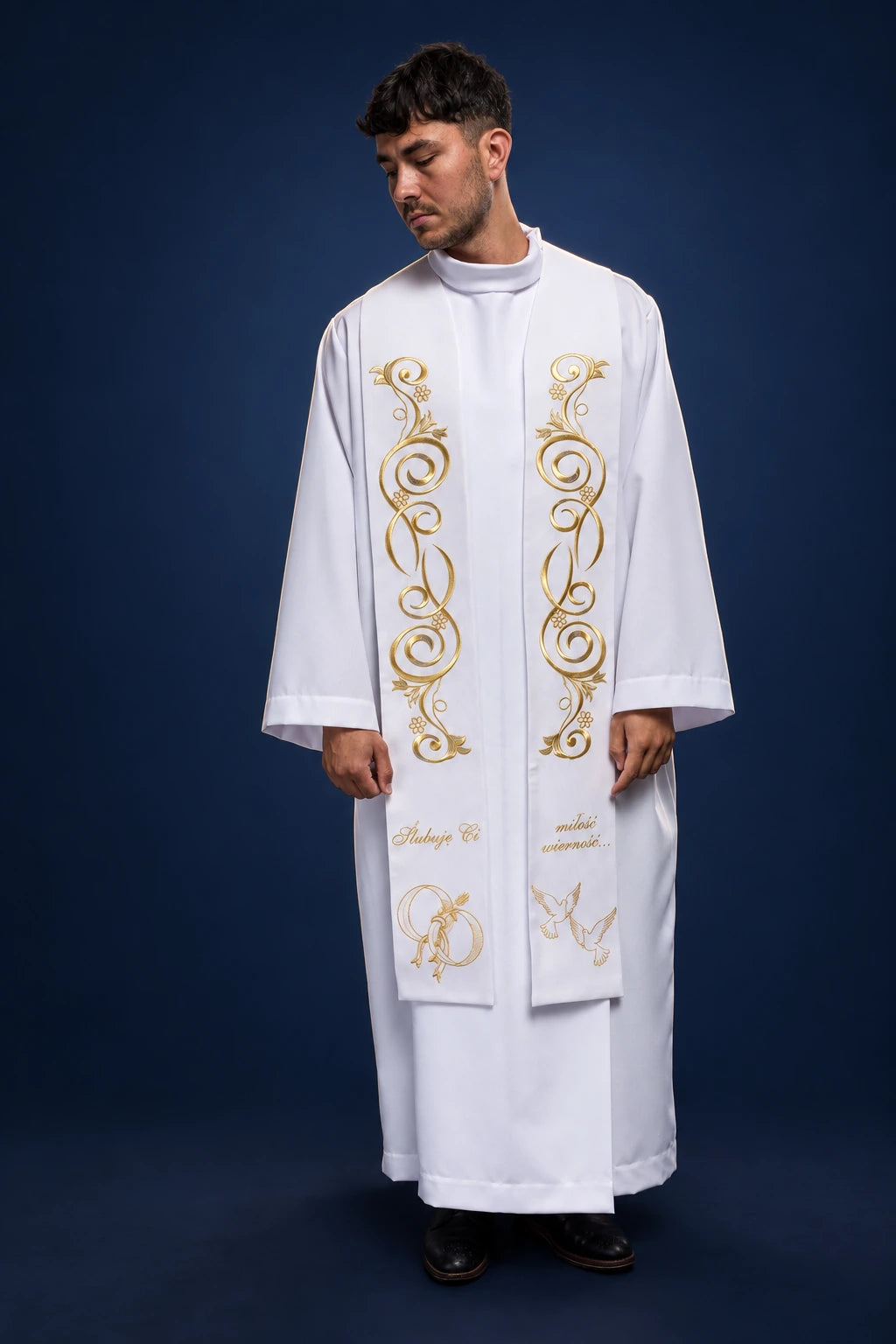 Front view of a long white wedding stole with gold embroidered scrollwork and monogram accents