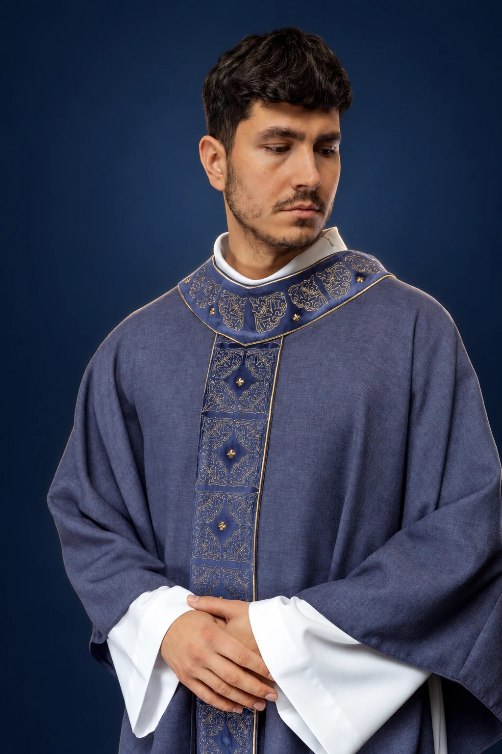 Front view of a purple chasuble with embroidered orphrey and matching collar trim