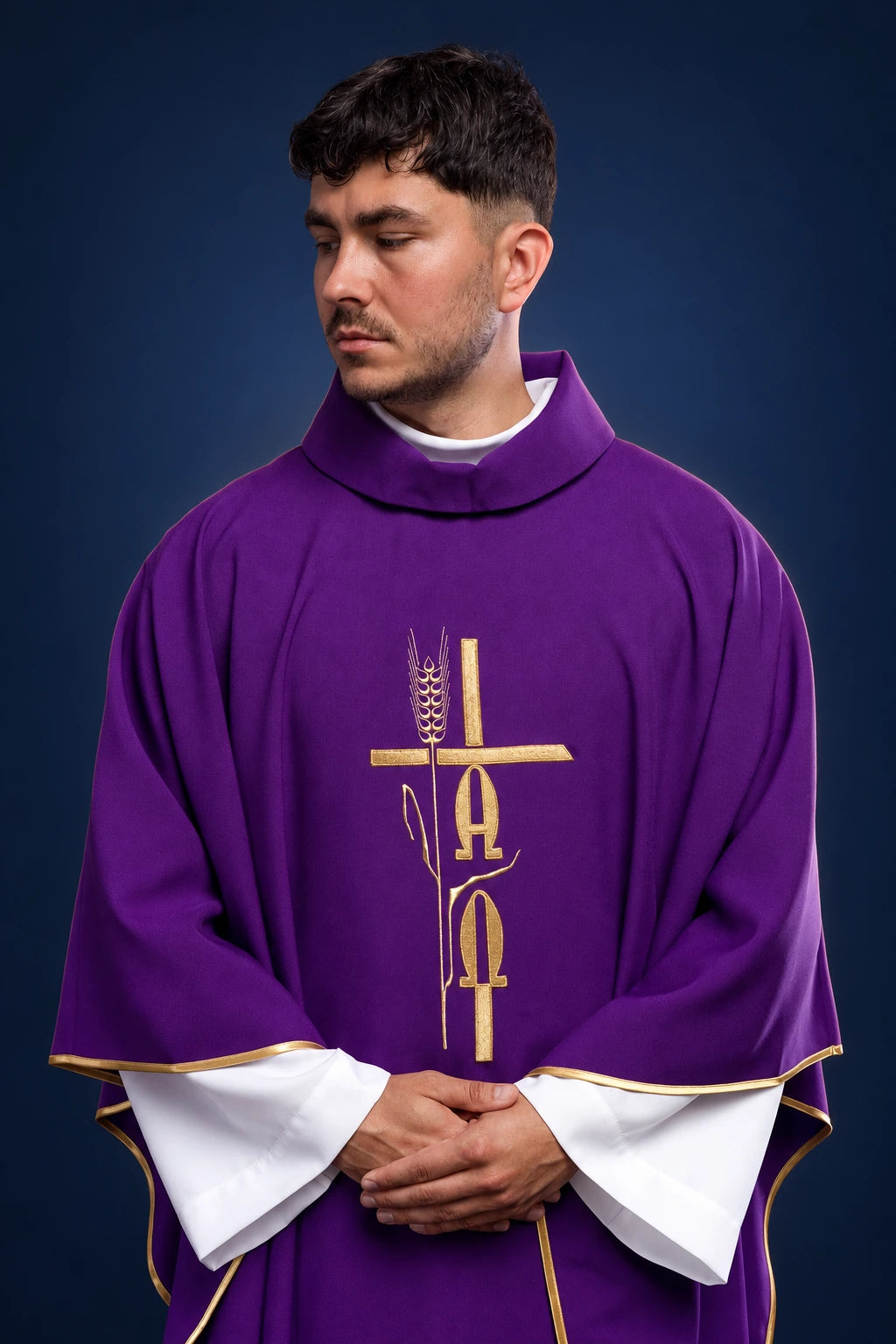 Front view of a purple chasuble with gold Alpha, Omega, and cross embroidery on the chest