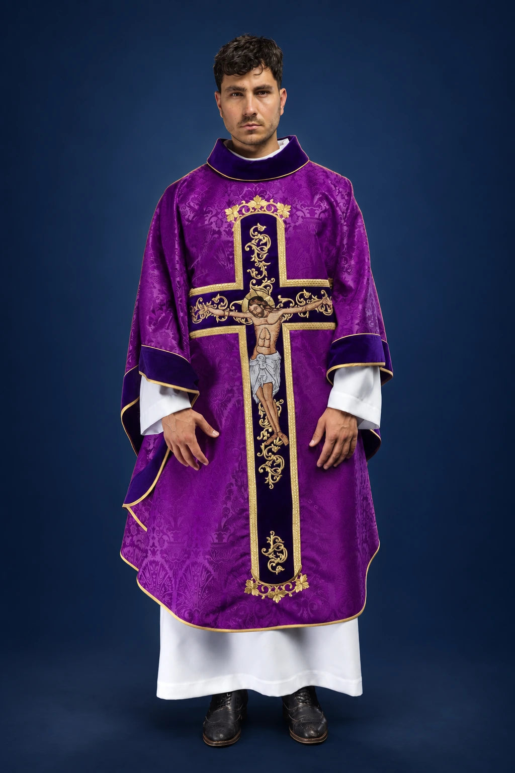 Front view of a purple chasuble with gold cross embroidery and Christ crucified motif