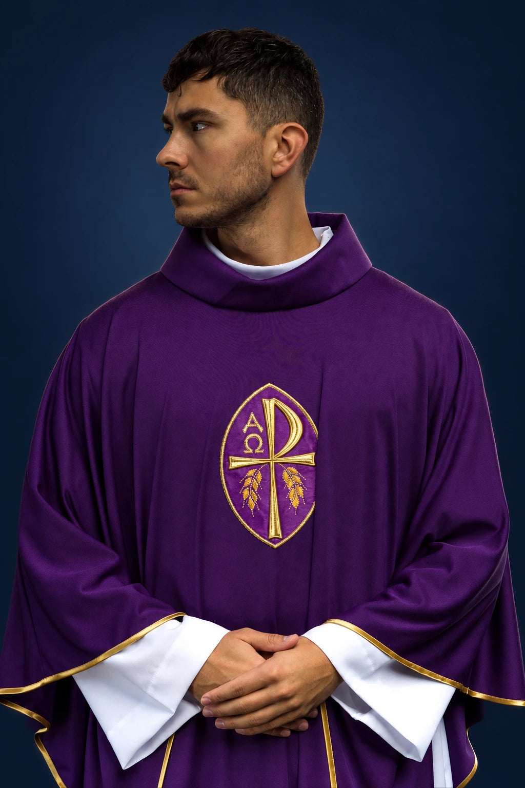 Front view of a purple chasuble with gold embroidered Christogram and cross motif, trimmed in gold