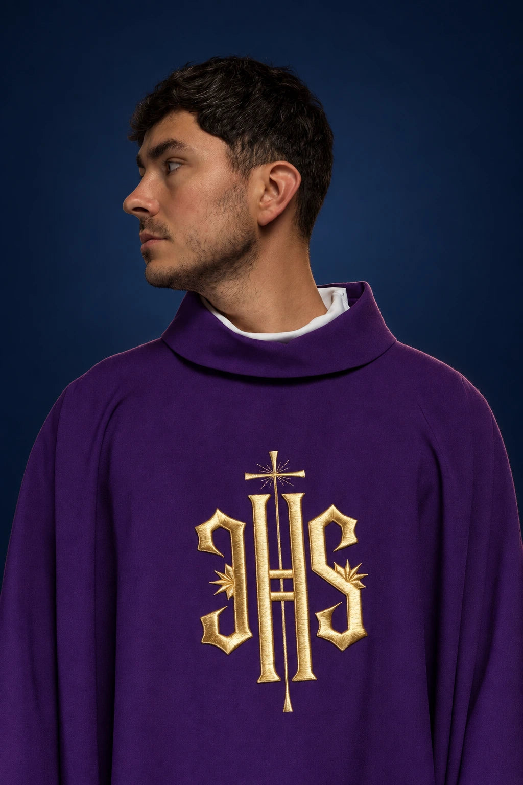 Front view of a purple chasuble with a gold IHS embroidery on the chest