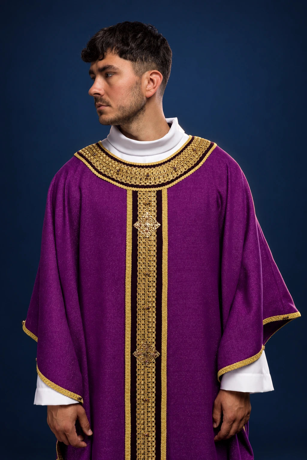 Front view of purple chasuble with gold-trimmed vertical and yoke bands, worn over a white alb