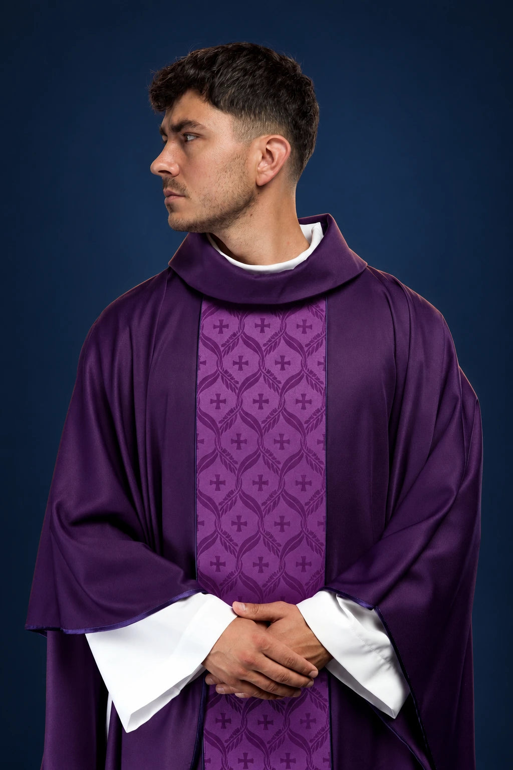 Front view of a purple chasuble with jacquard orphrey and cross motifs