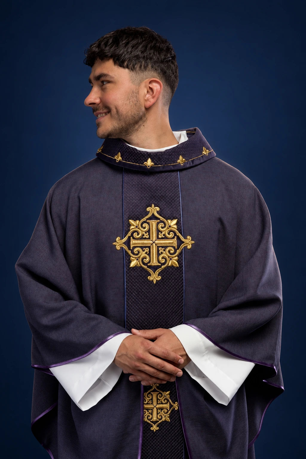 Front view of a purple chasuble with velvet orphrey and gold cross embroidery