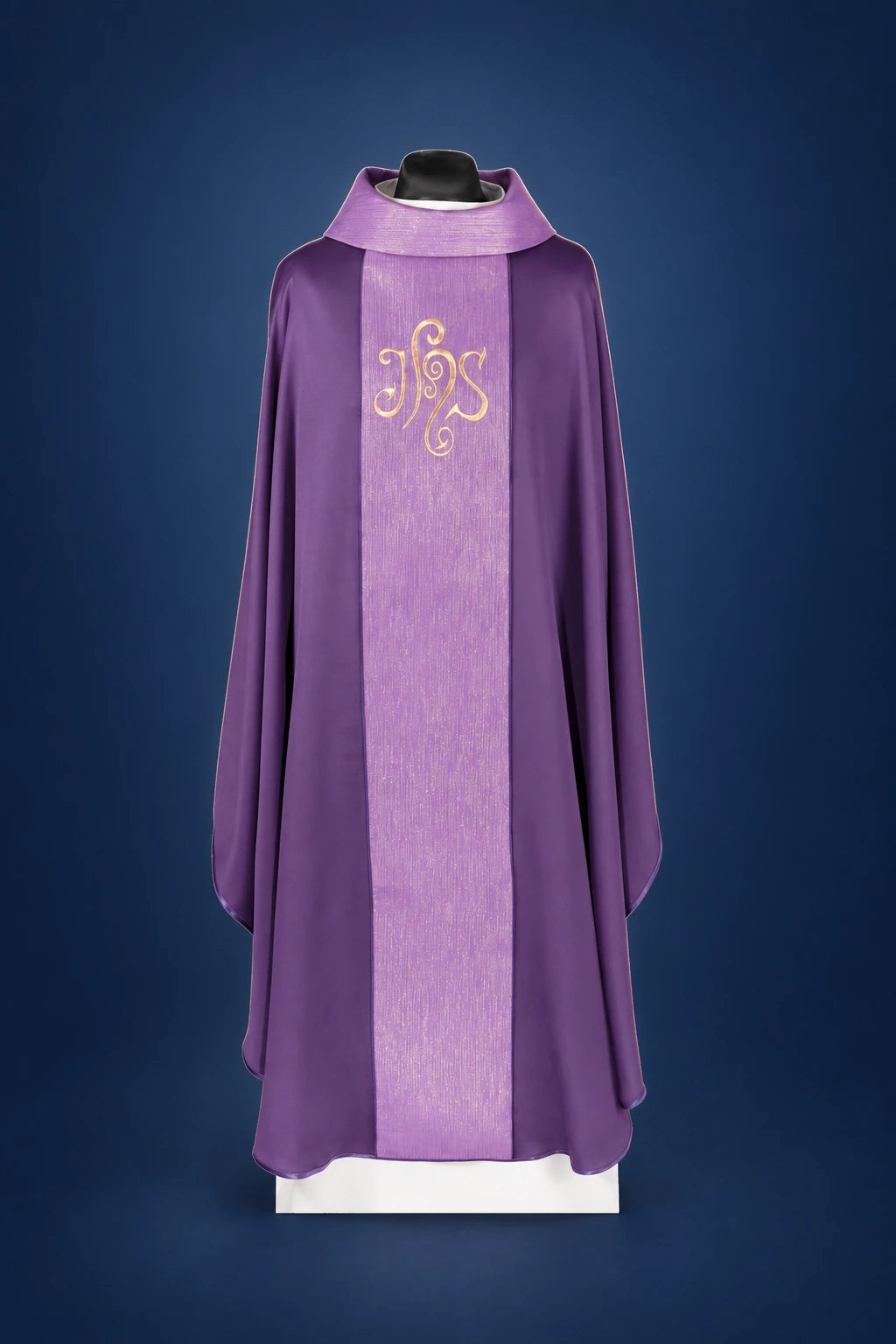 Front view of a purple chasuble with a wide vertical orphrey and IHS embroidery on the chest