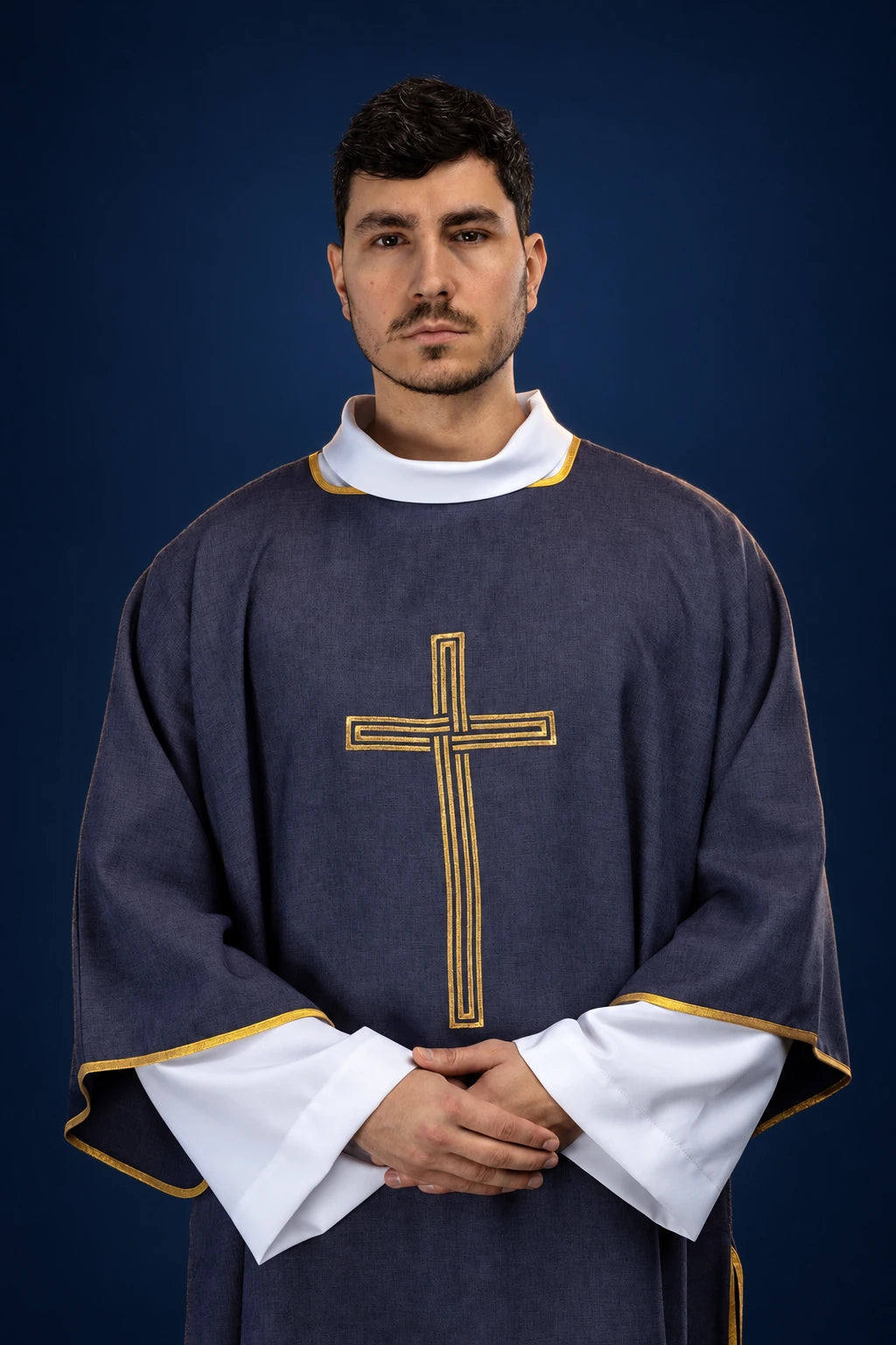 Front view of a purple dalmatic with wide sleeves and an embroidered gold cross on the chest.