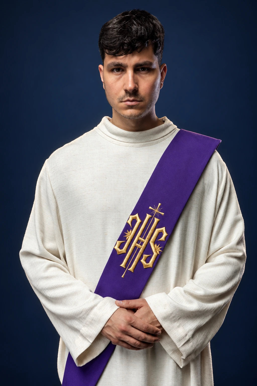 Front view of a purple deacon stole with gold IHS and cross embroidery, worn over a white alb