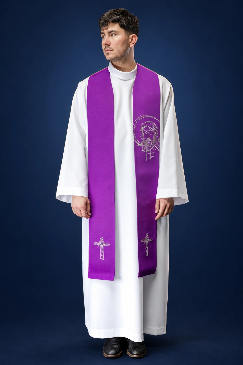 Front view of a purple embroidered stole with crosses and a Jesus motif, worn over a white alb