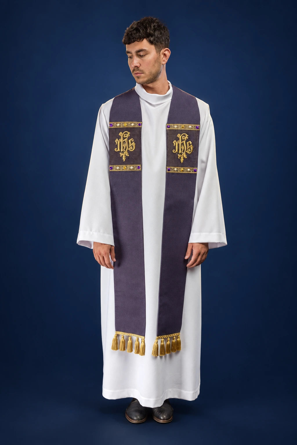 Front view of a purple embroidered stole with IHS motifs and gold fringe