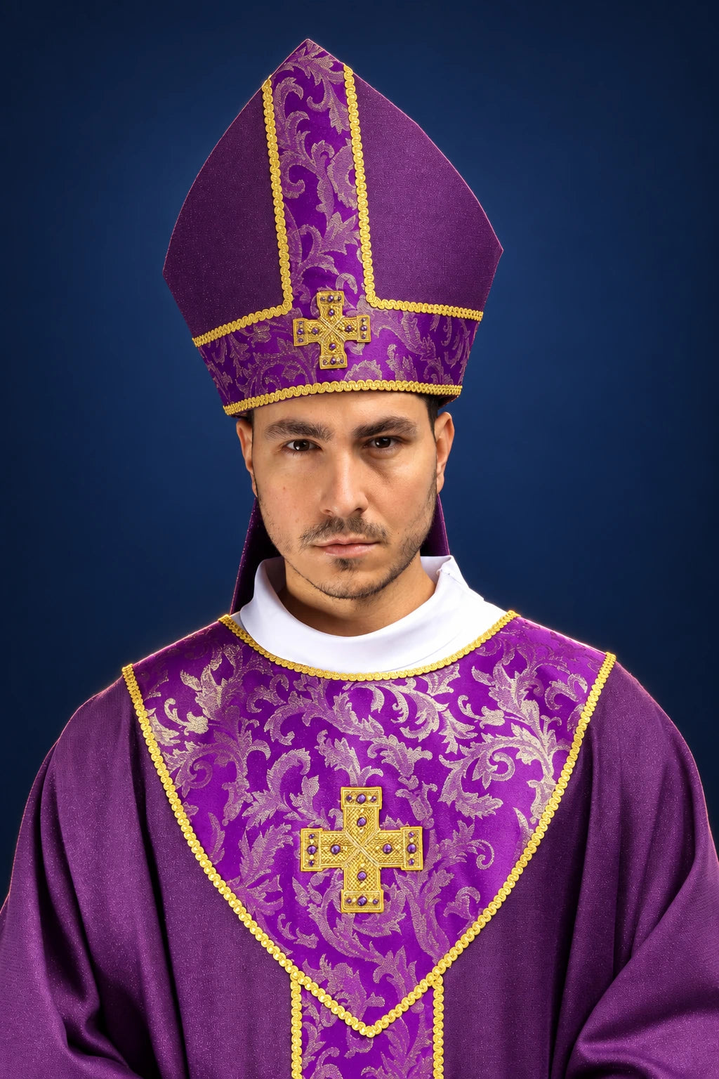 Front view of a purple miter and matching vestment with embroidered cross and jacquard trim