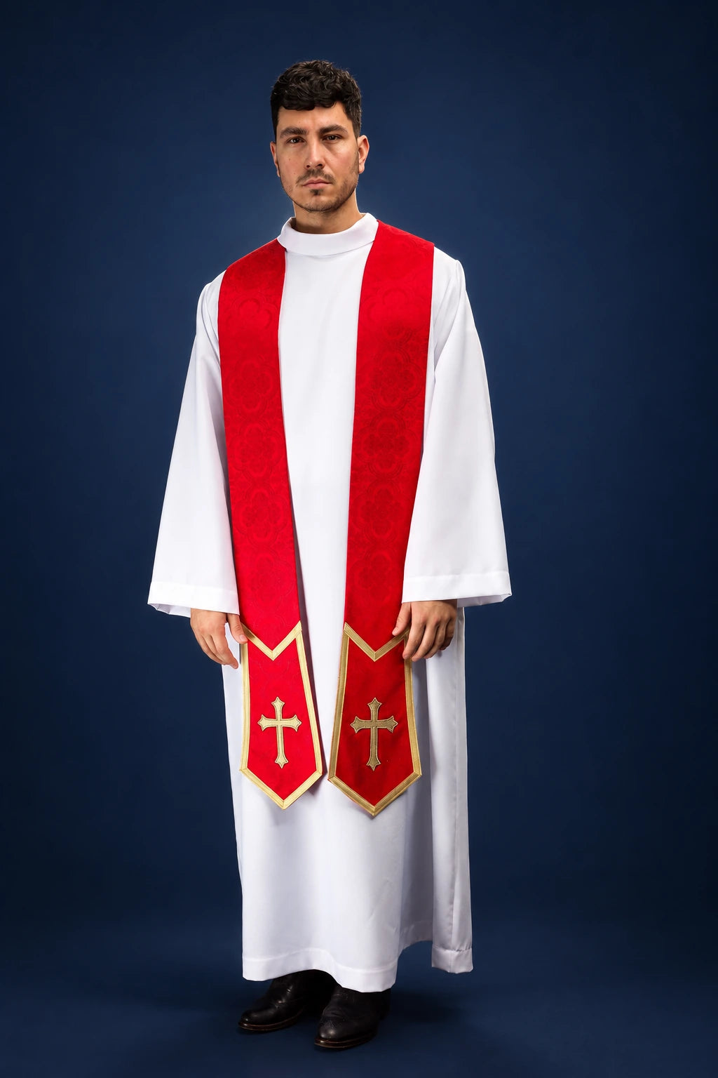 Front view of a red Catholic stole with gold cross embroidery and gold-edged pointed ends over a white alb