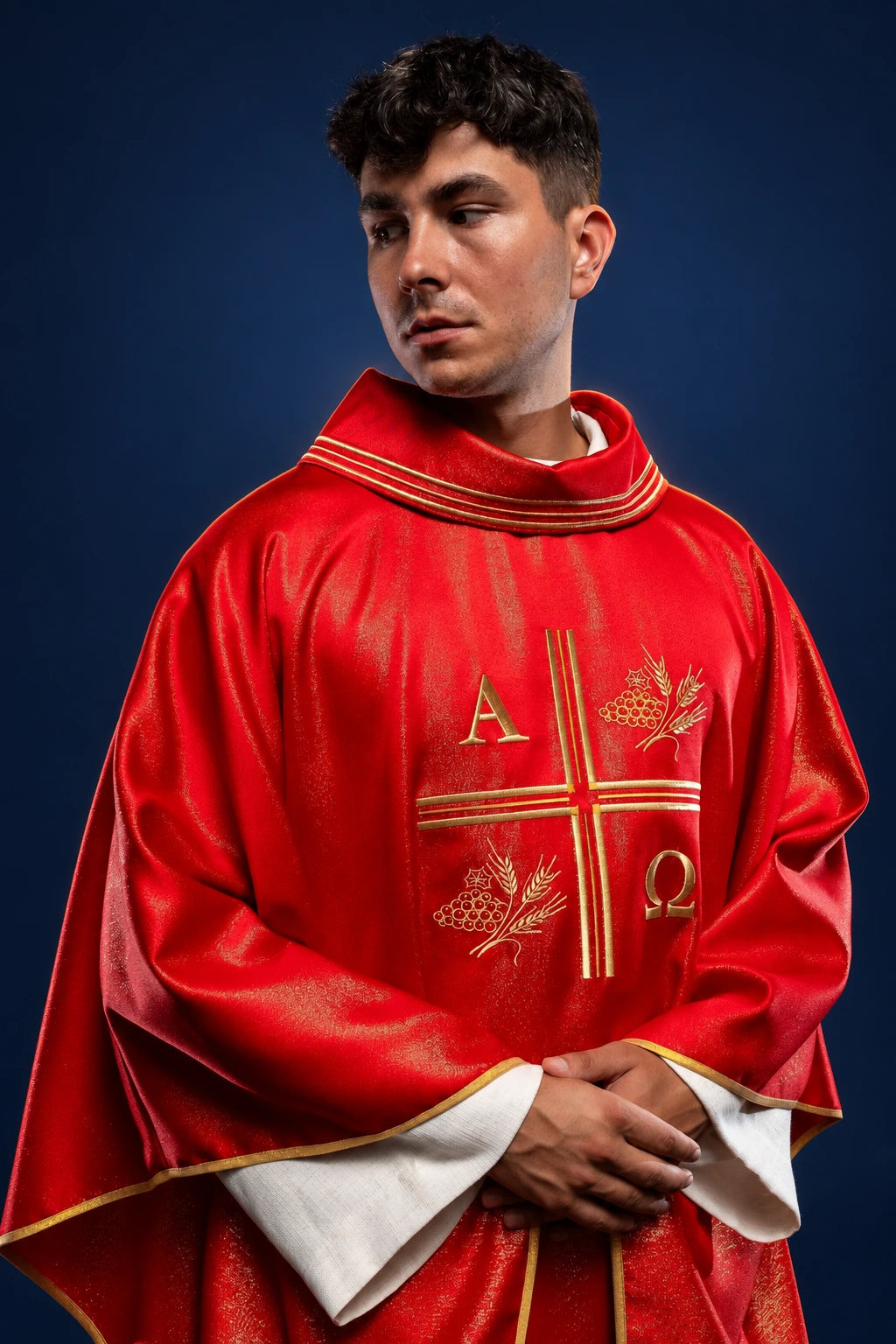 Front view of red chasuble with gold embroidered cross, Alpha Omega, and wheat motifs
