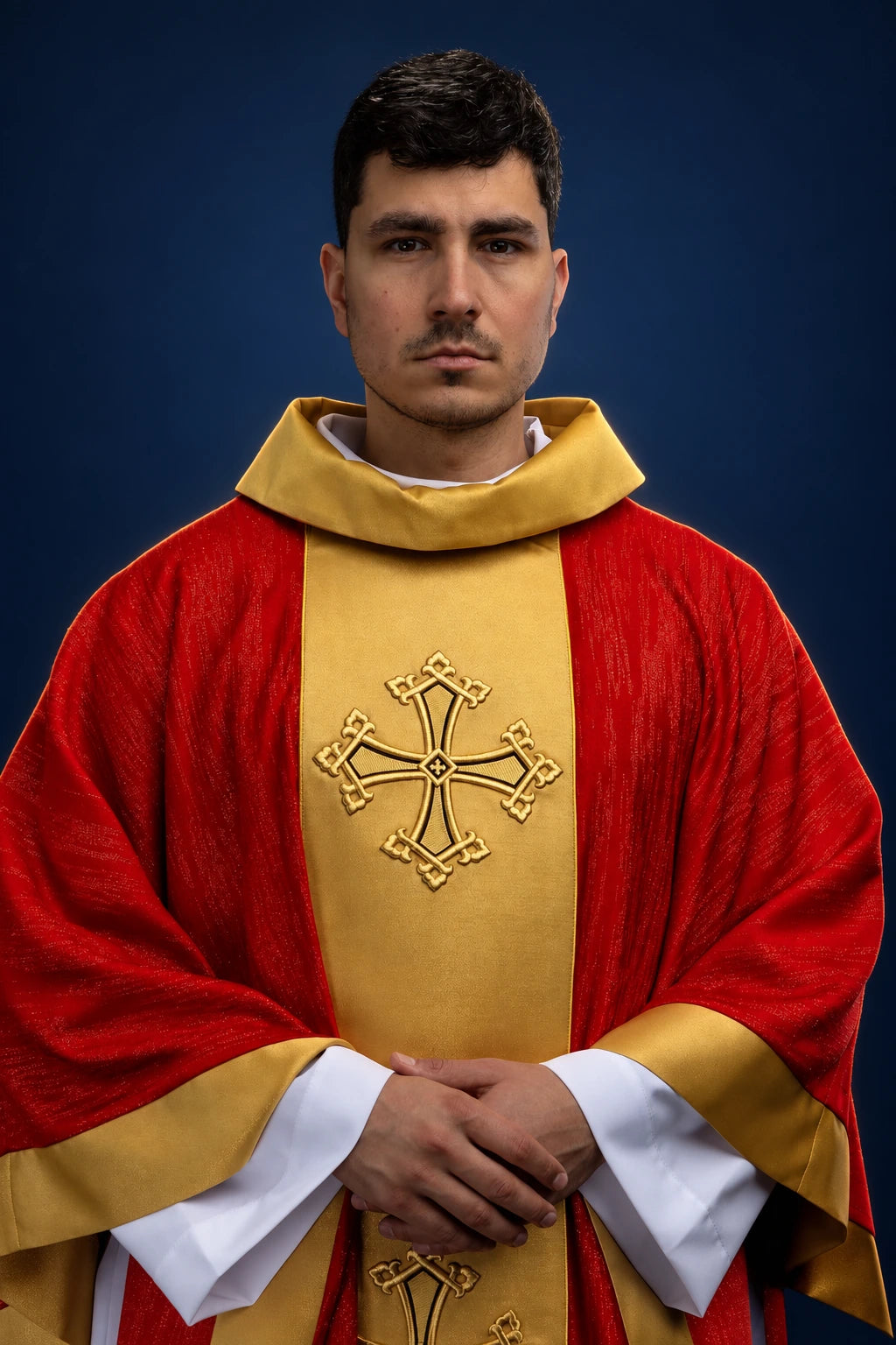 Front view of red chasuble with gold orphrey and embroidered cross on the chest