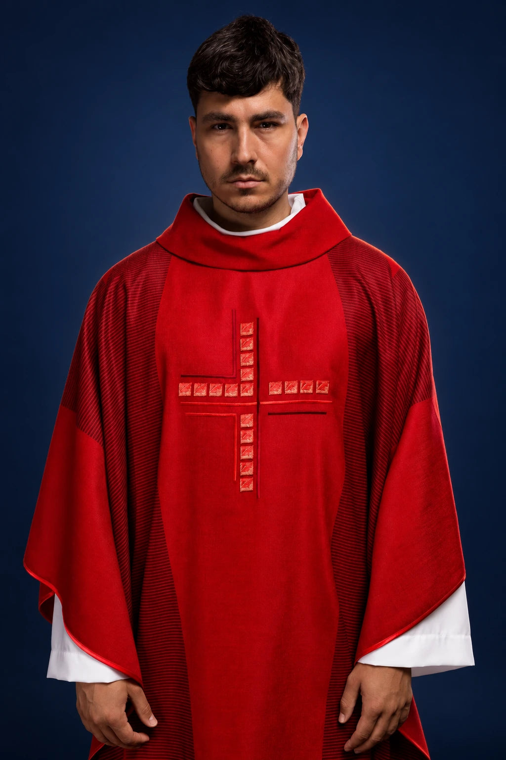 Front view of a red chasuble with a square cross motif on the chest
