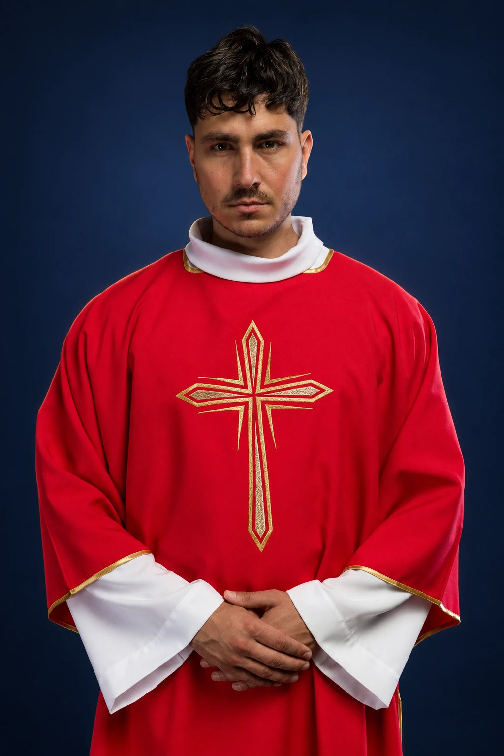 Front view of a red dalmatic with wide sleeves and embroidered gold cross on the chest