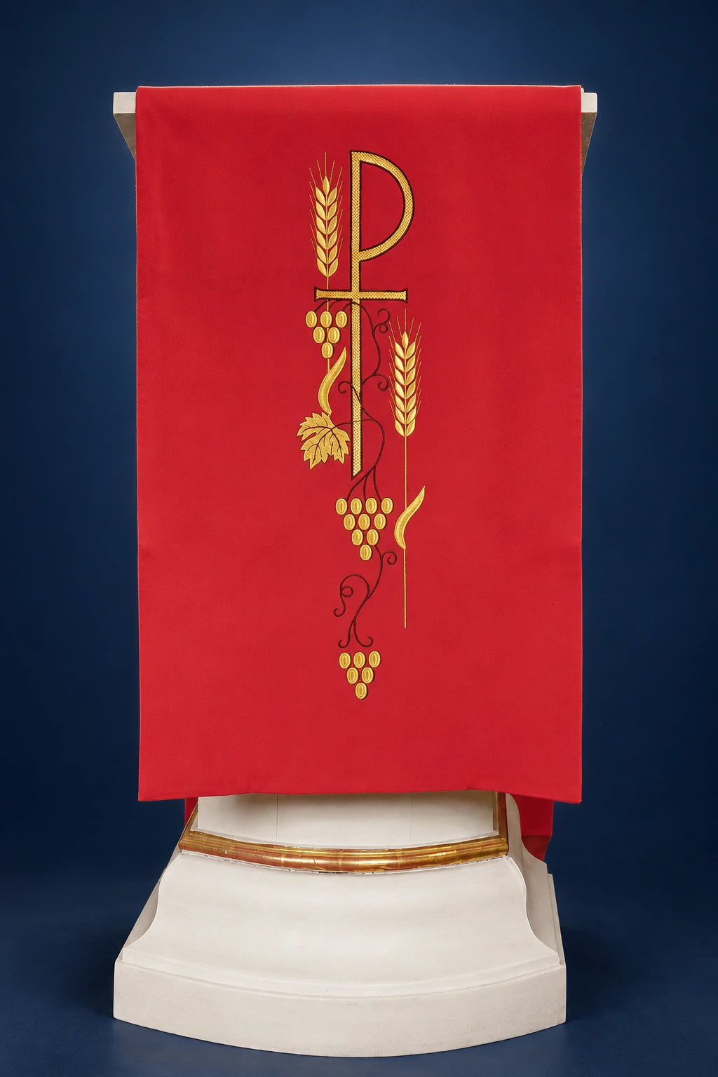 Front view of a red lectern cover with embroidered PAX monogram and wheat and grape motif