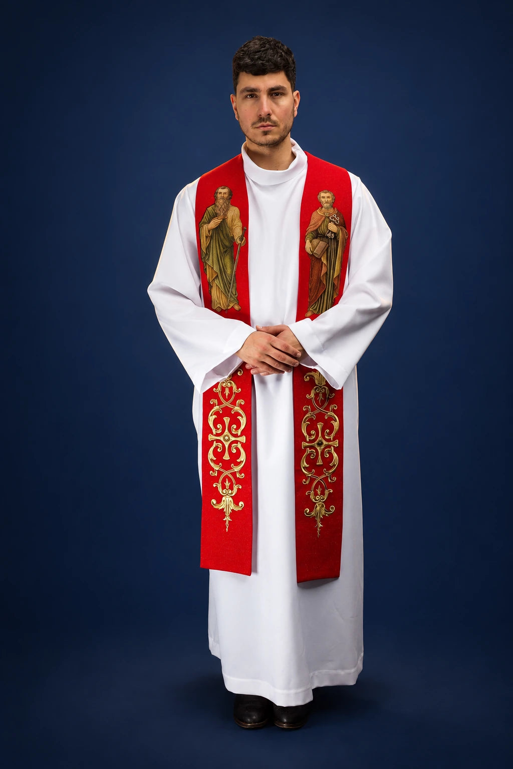 Front view of a red stole with embroidered Saints Peter and Paul and gold ornate scrollwork panels