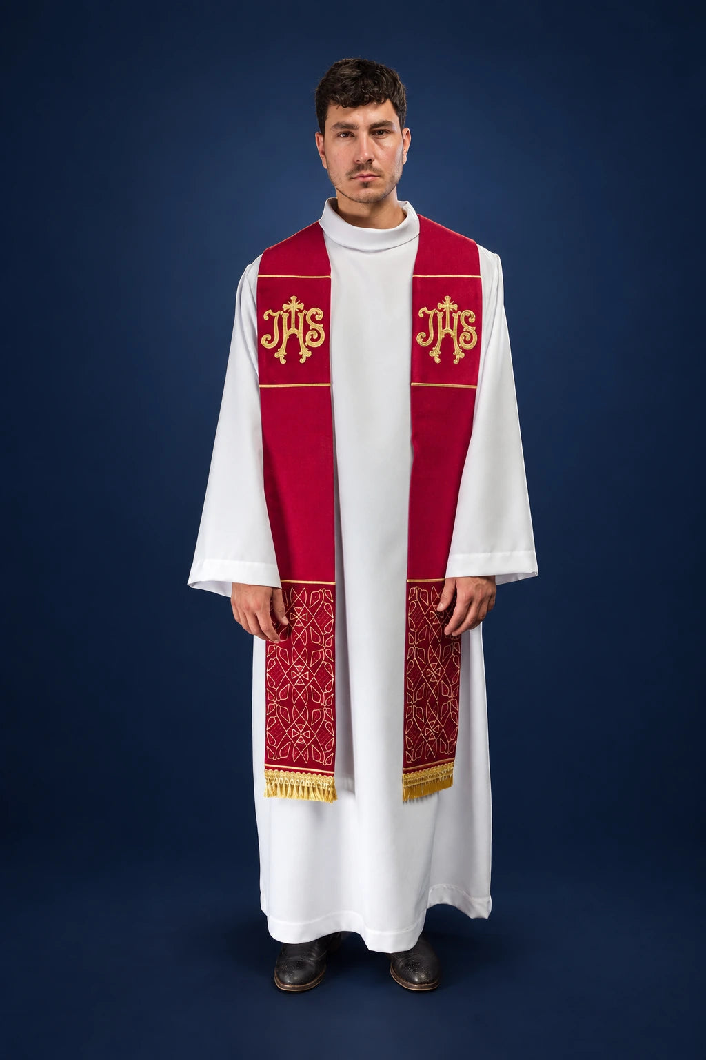 Front view of a red velvet Catholic stole with gold IHS embroidery and patterned lower panels