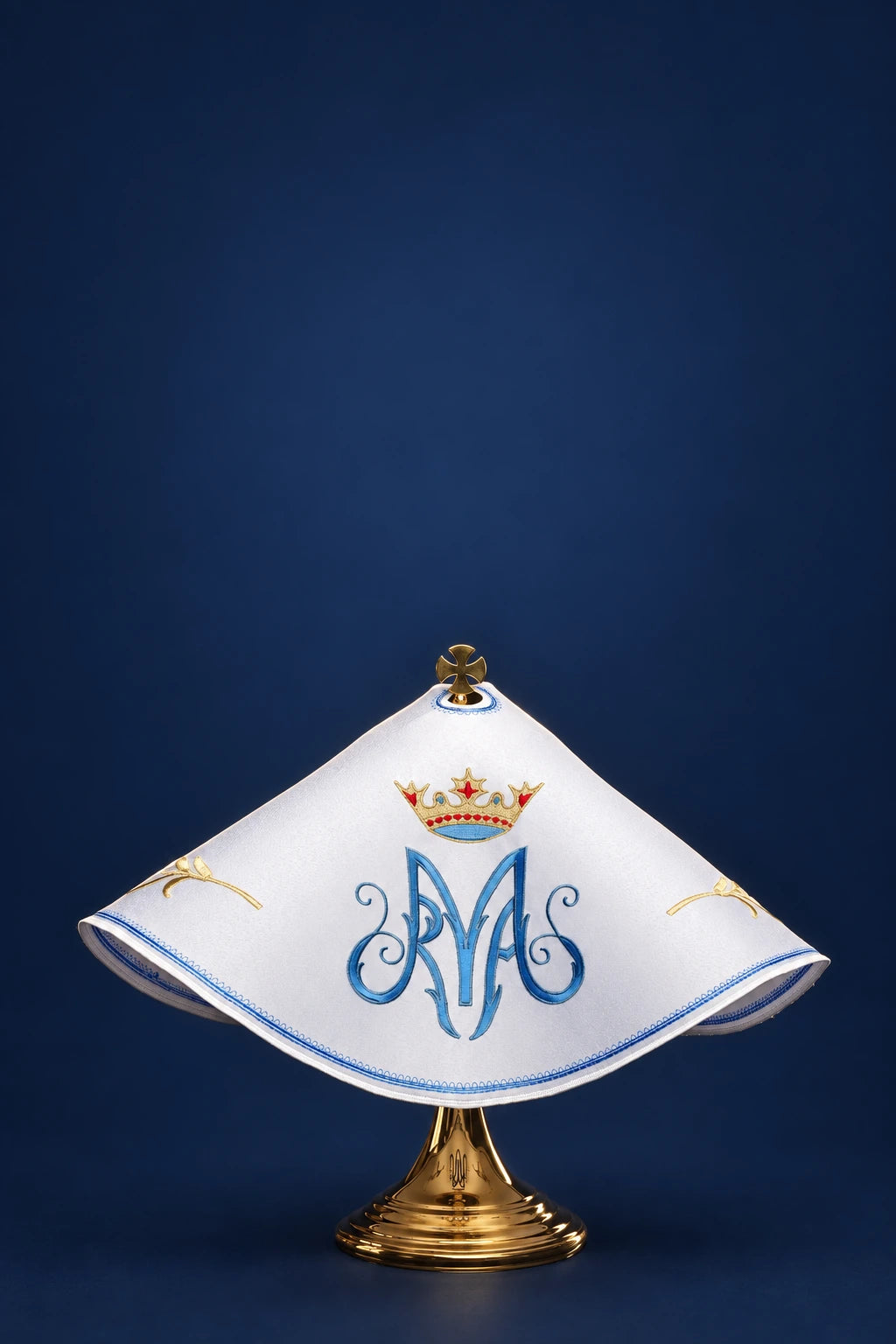 Front view of a white ciborium veil with blue Marian monogram and gold crown embroidery, trimmed in blue and gold