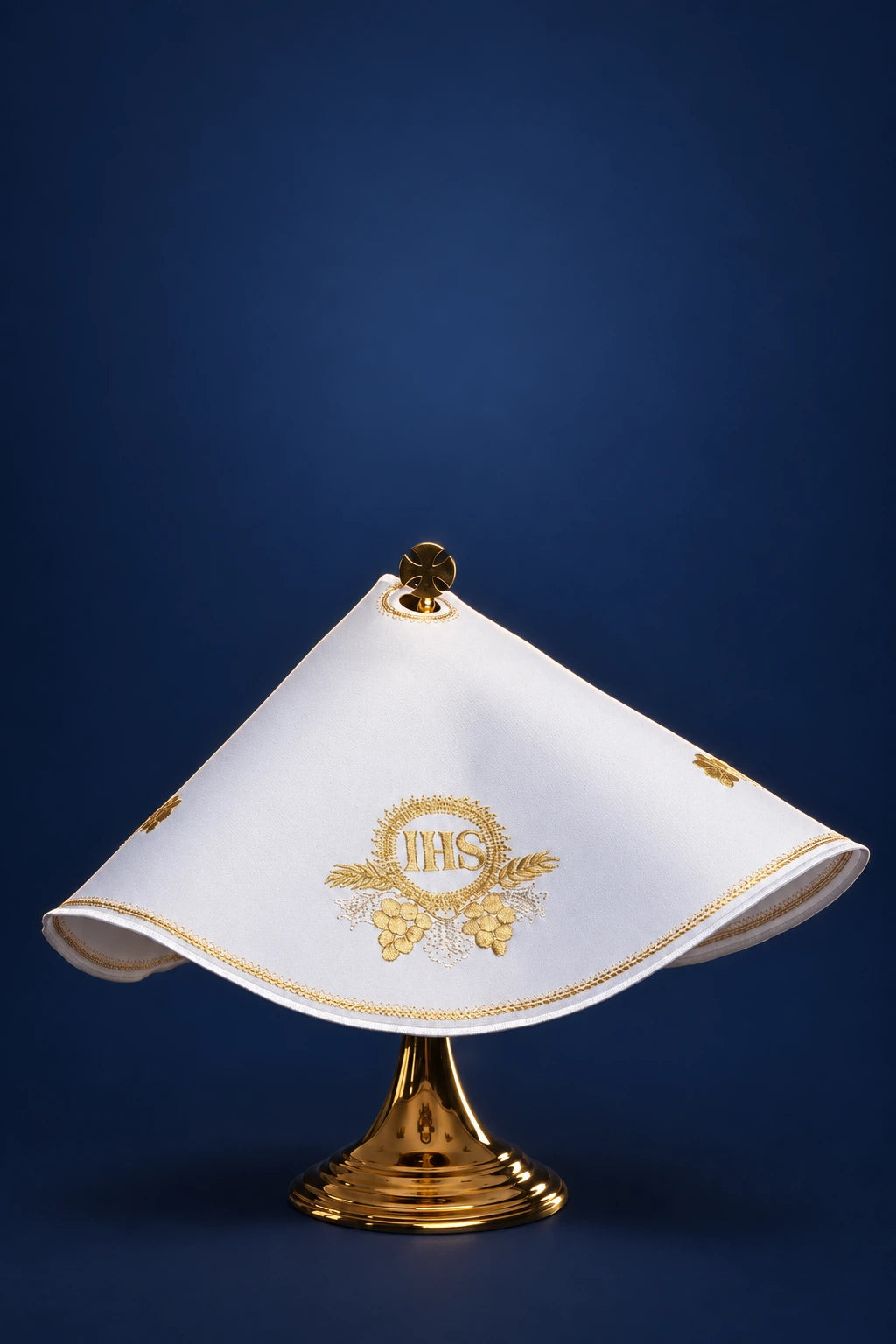 Front view of a white ciborium veil with gold IHS, wheat, and grapes embroidery