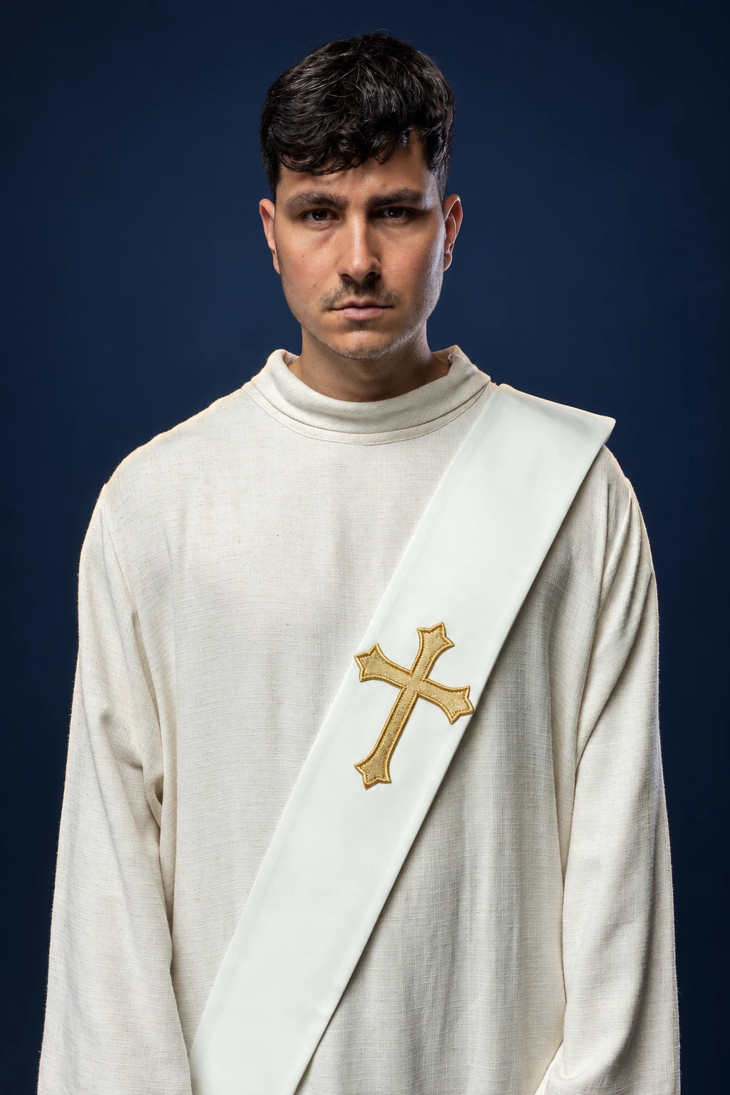 Front view of a white deacon stole with a gold cross, worn diagonally over one shoulder