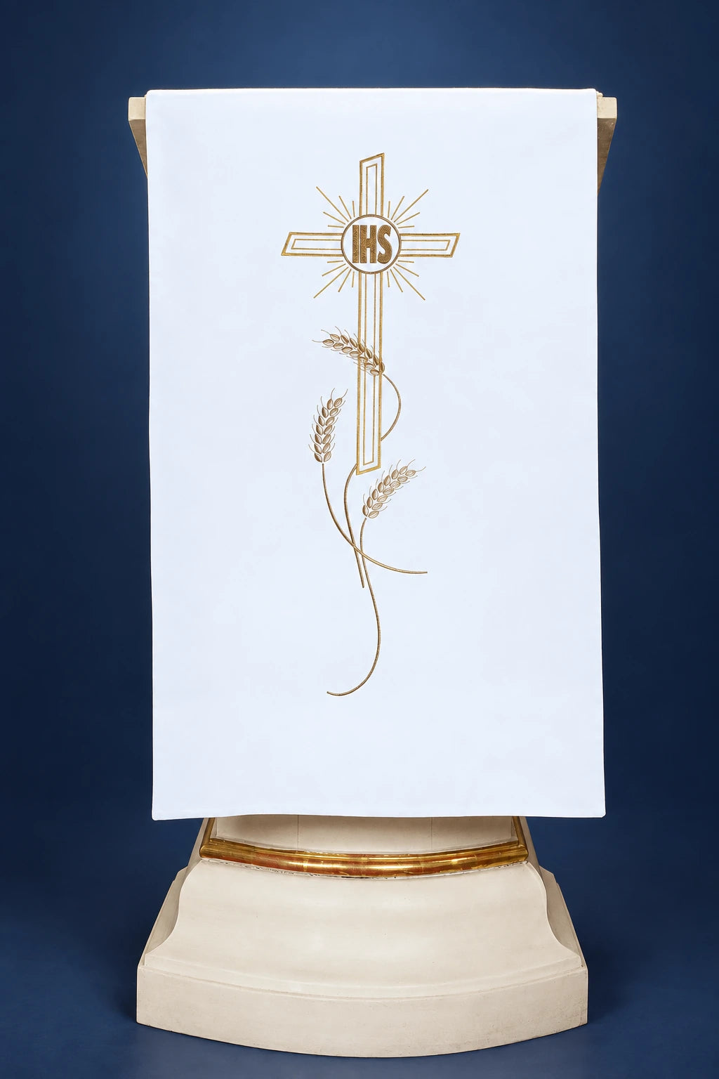 Front view of a white lectern cover with gold cross, IHS, and wheat embroidery
