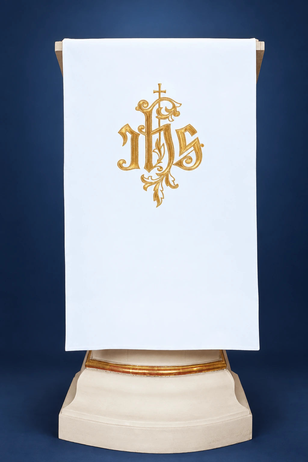Front view of a white lectern cover with gold IHS embroidery centered on the panel
