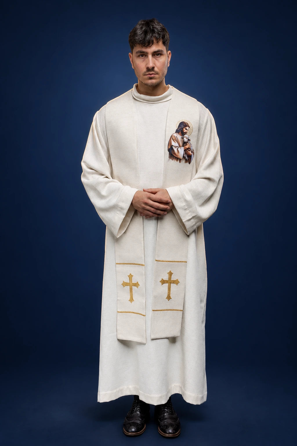Front view of a white liturgical stole with embroidered Good Shepherd and lamb, plus gold crosses near the hem
