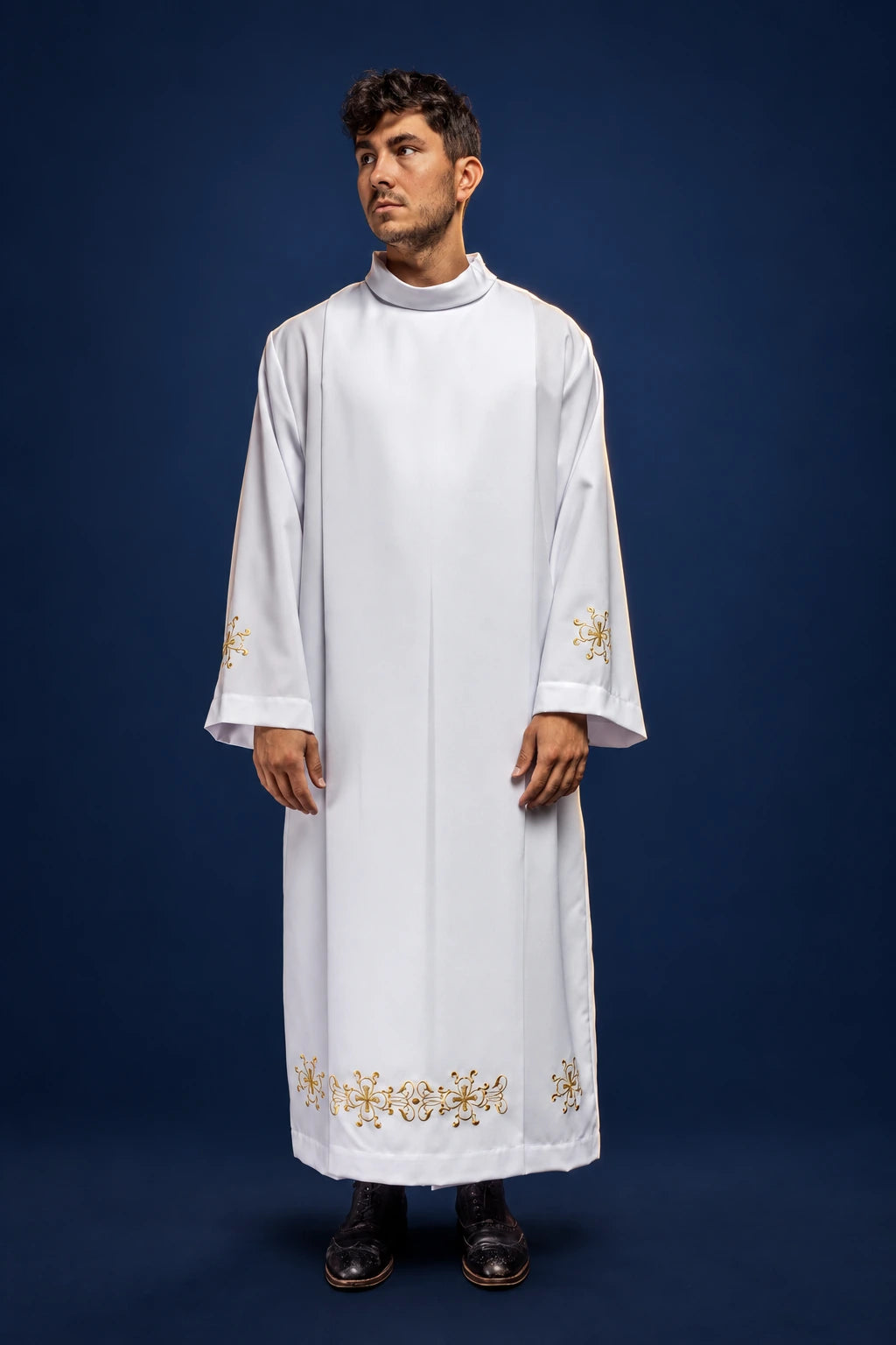 Front view of white priest alb with stand-up collar, hood, and gold embroidered hem and cuffs