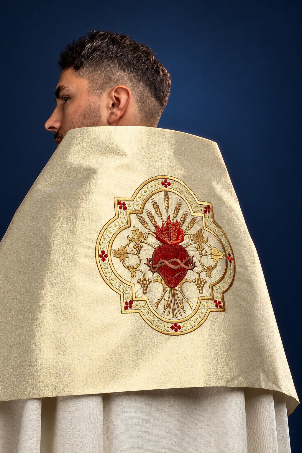 Gold humeral veil back view with Sacred Heart embroidery centered on the shoulder panel