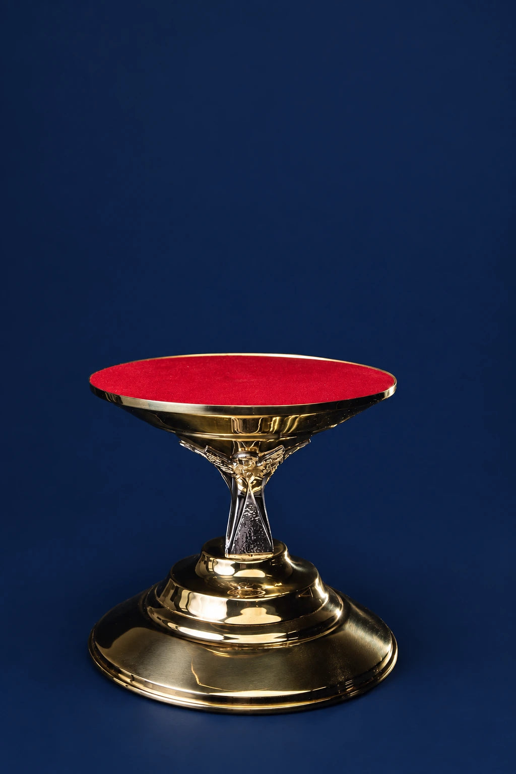 Gold-plated brass thabor table with red-lined top and angel motif base, front view