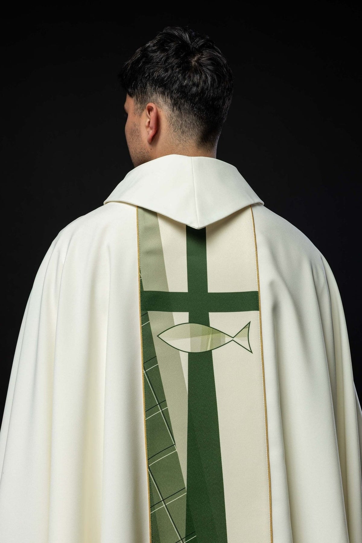 White chasuble detail showing gold trim and sleeve edge