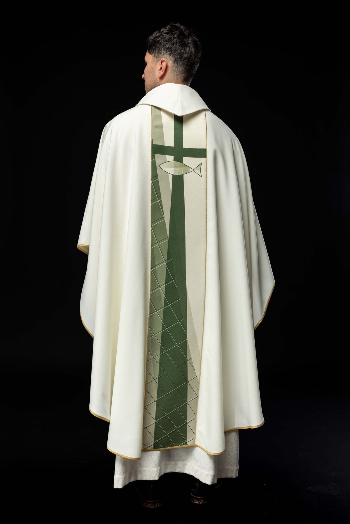 White chasuble back view with green cross, fish and geometric embroidery