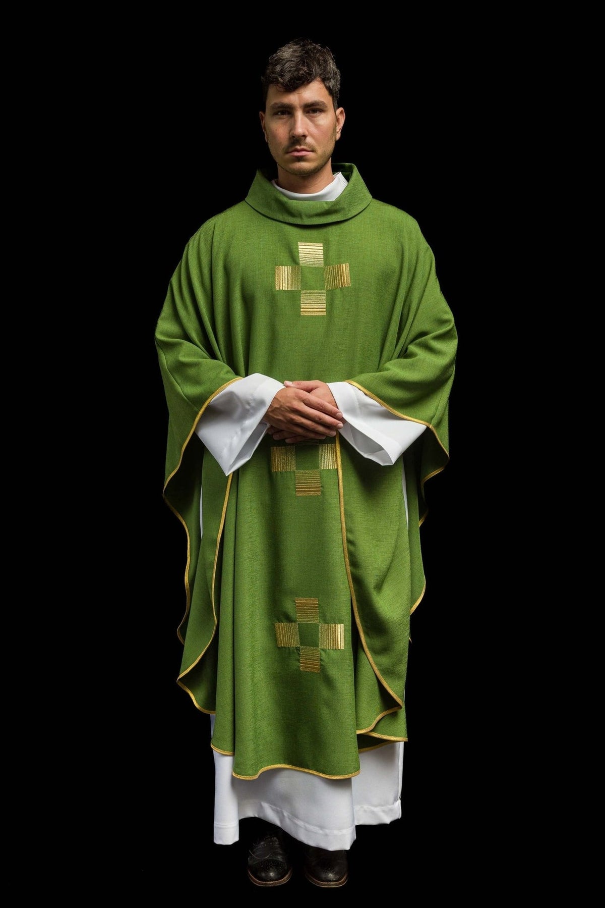 Green chasuble worn front view showing three gold embroidered crosses