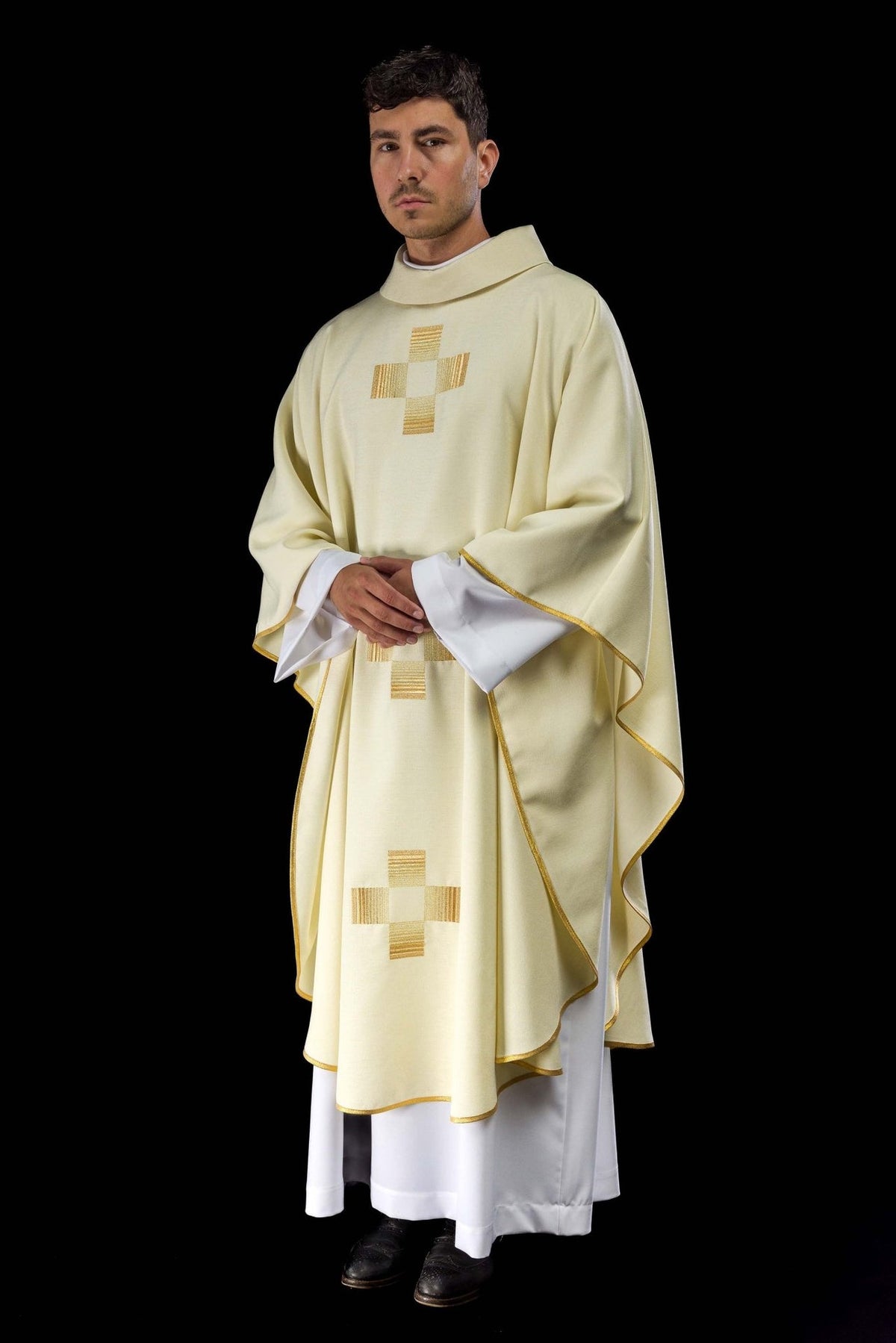 Ivory chasuble three-quarter front view with gold trim and embroidered crosses