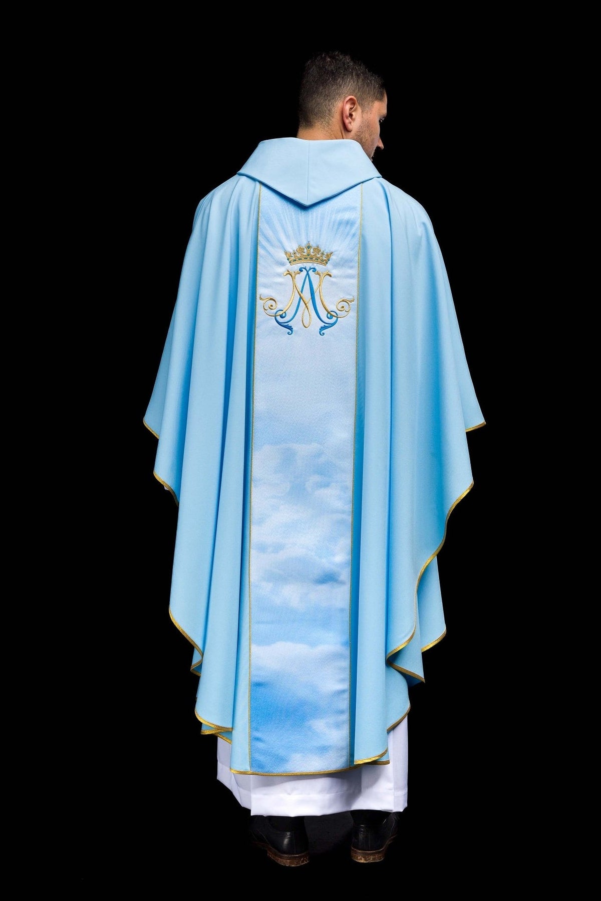 Blue Marian chasuble full back view with cloud-patterned orphrey and embroidered Marian symbol