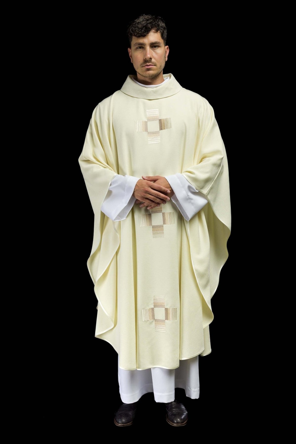 Ecru chasuble, full front view with embroidered crosses and wide draped shape