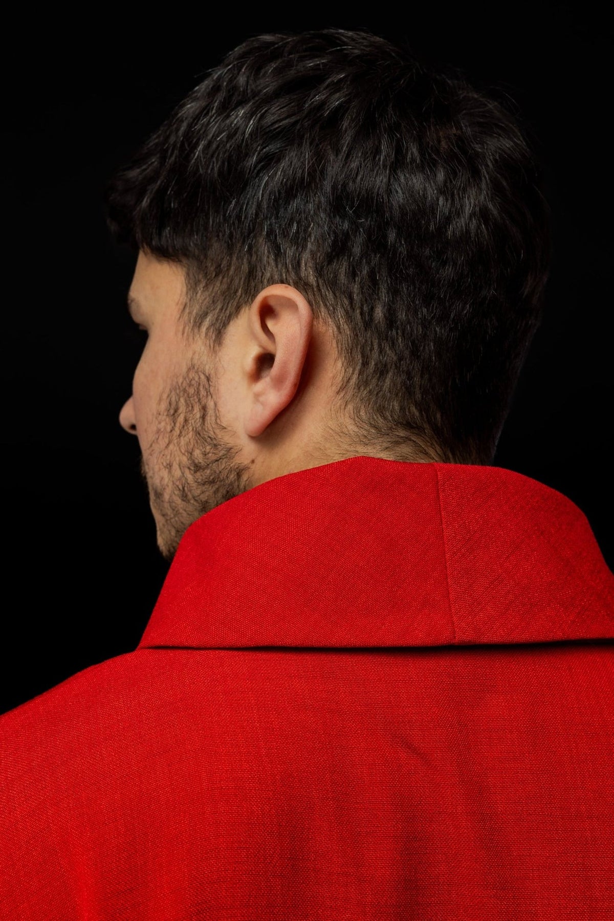Red chasuble back view with stand-up collar and satin trim