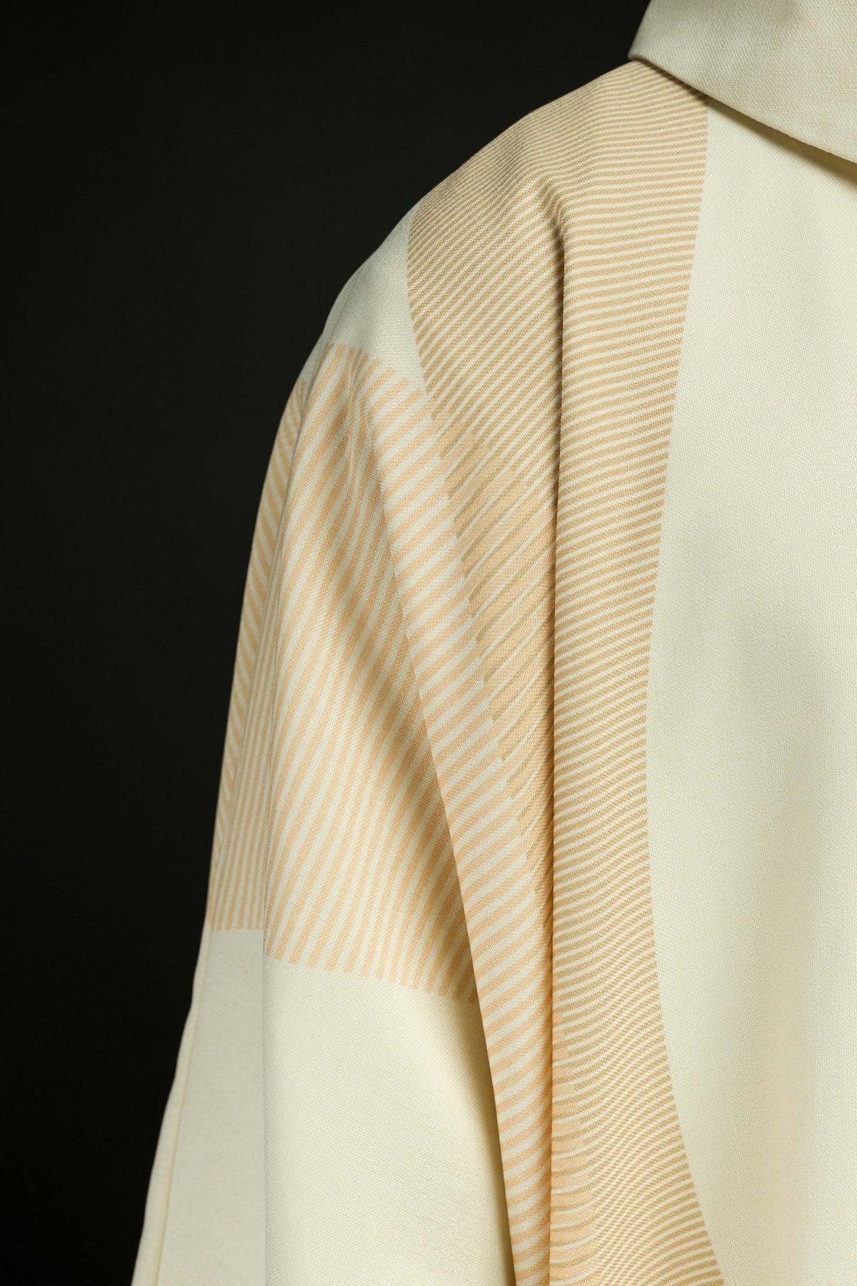Ecru chasuble close-up of striped trim on the shoulder