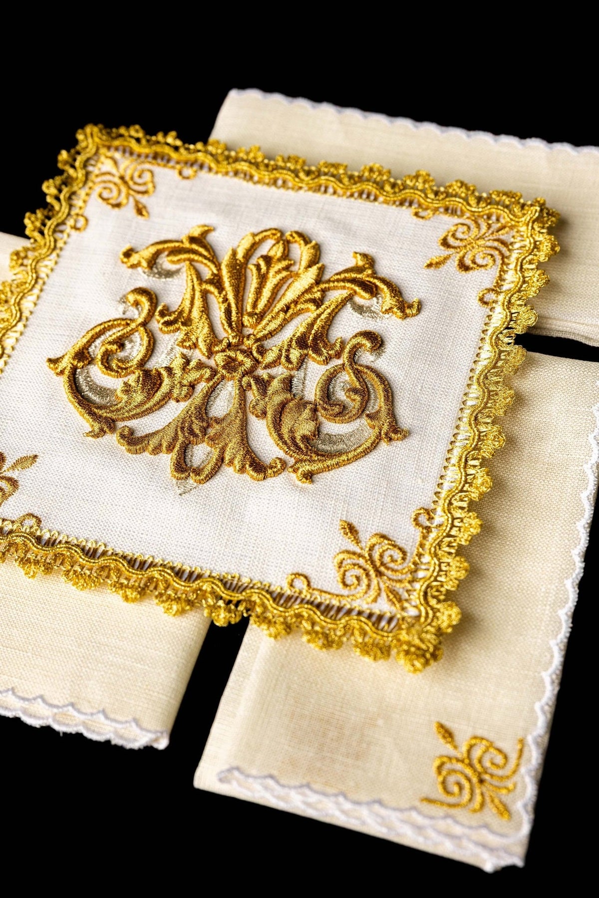 Altar linen set close-up showing ornate gold embroidery and scalloped edging
