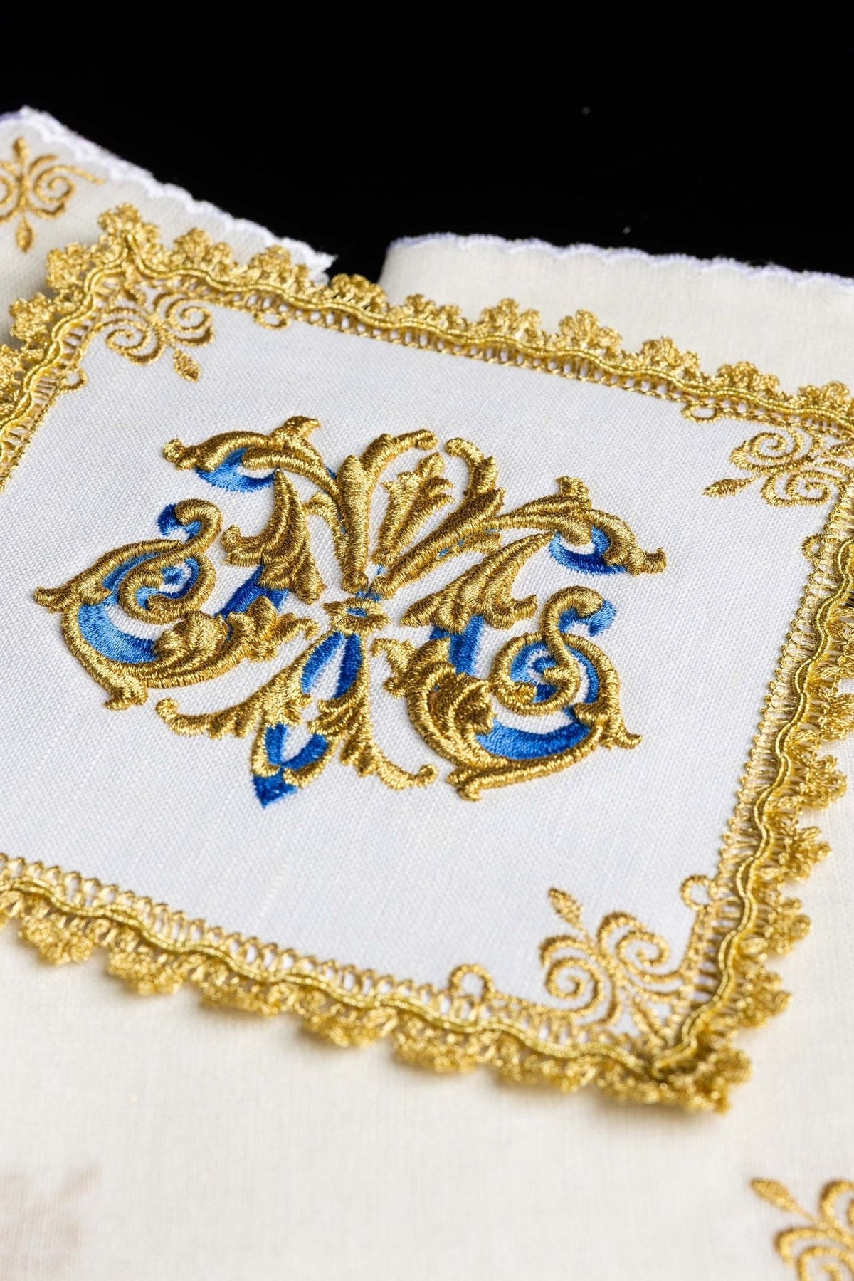 Altar linen set close-up with gold and blue Marian symbol embroidery