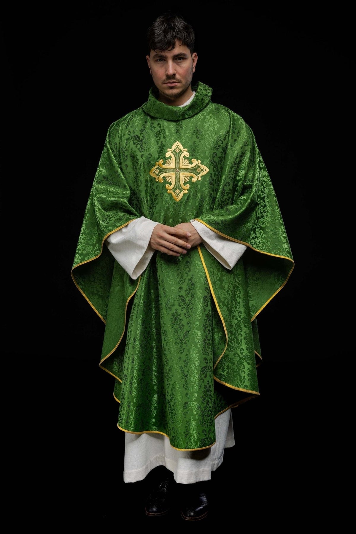 Green chasuble full back view with gold trim and embroidered cross