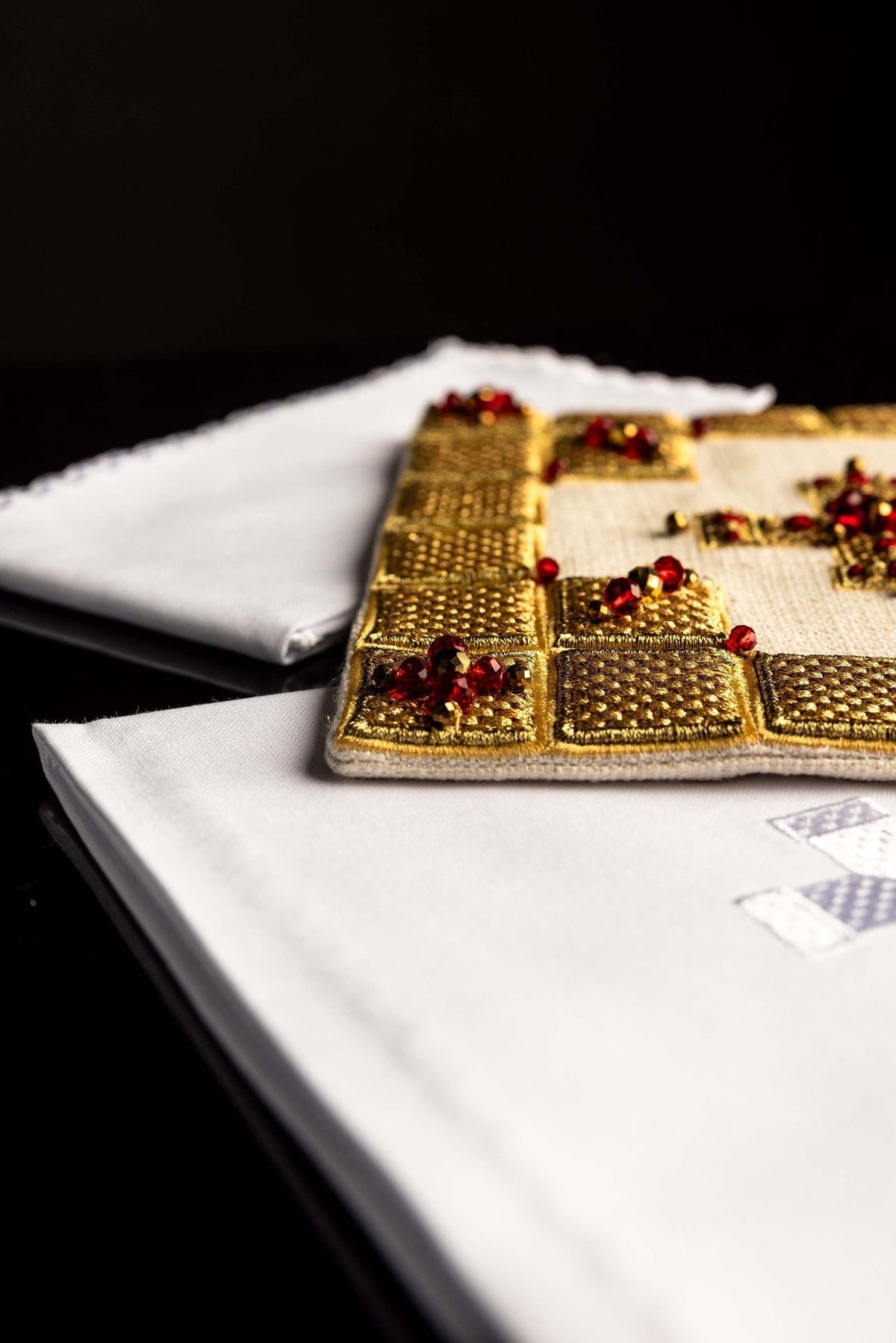 Altar linen set close-up showing gold border embroidery and white cloth cross