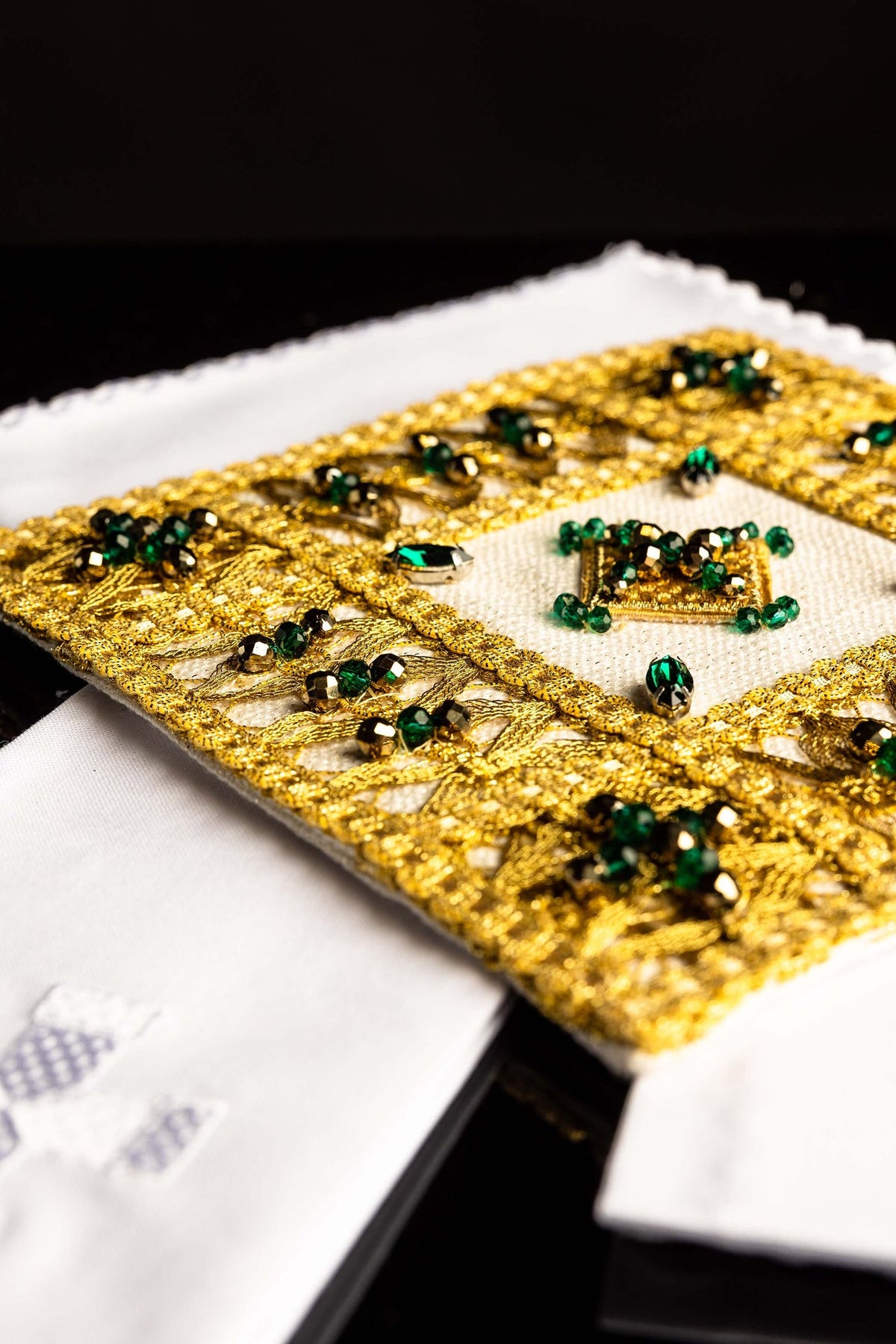 Altar linen set detail of gold embroidered border and white linen with silver cross