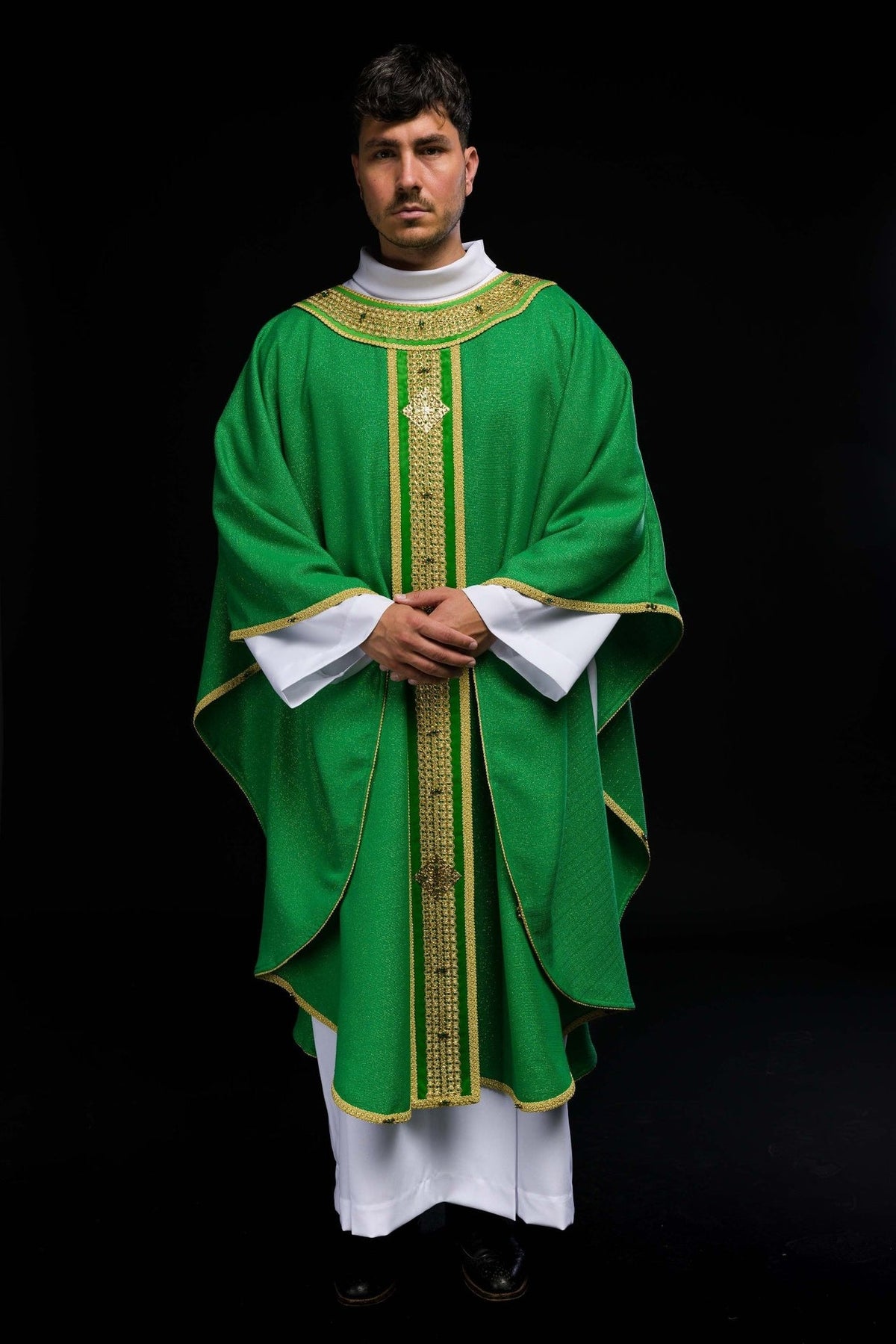 Green chasuble worn in a full front view with gold orphrey and embroidery
